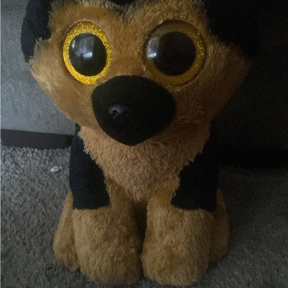 Black and Brown Plush Dog Toy with Large Eyes